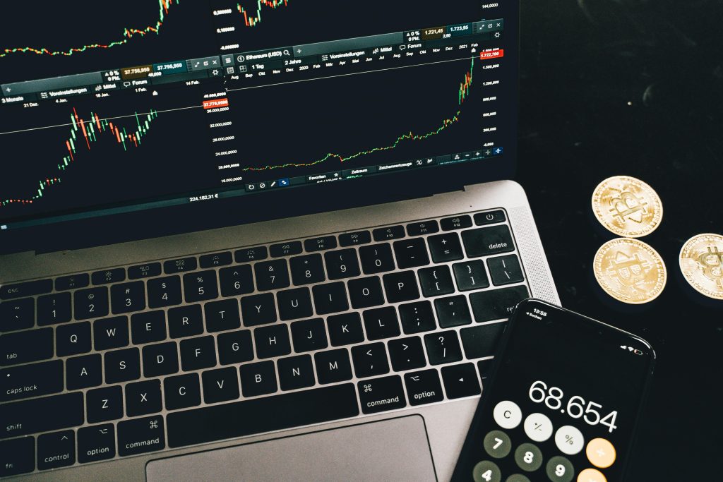Why Open-Source Trading Bots Are Changing the Game for Beginners a laptop and a calculator